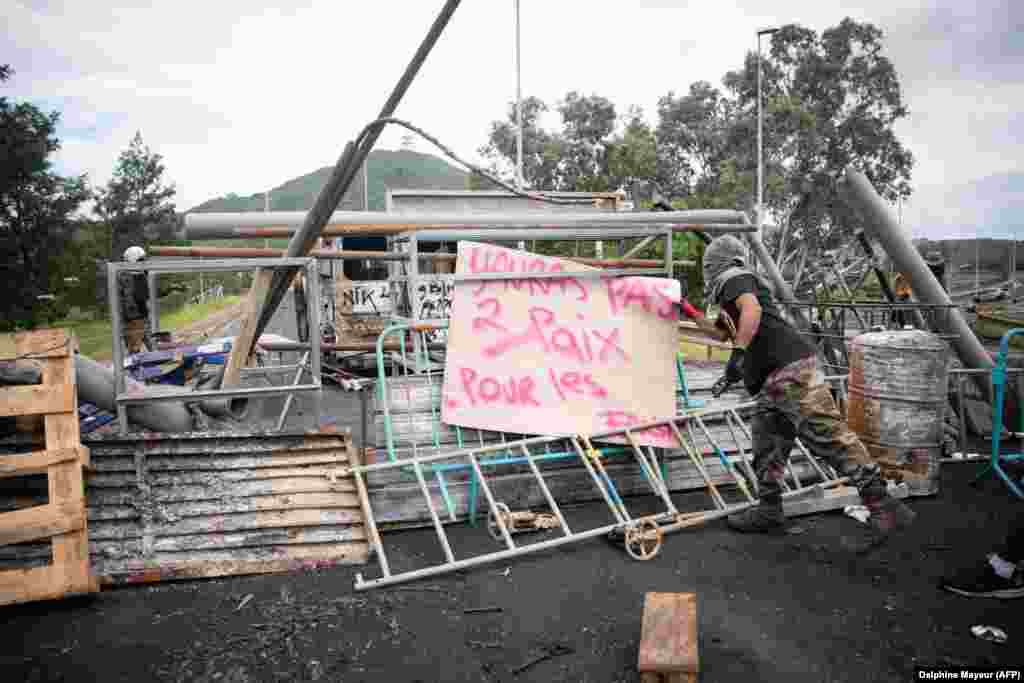 A roadblock in Ducos, New Caledonia, with a sign saying, &quot;There will be no peace for fascists,&quot; on May 21. Paris has accused Azerbaijan of stoking tensions in New Caledonia in revenge for French support for ethnic Armenians amid the recent war over Nagorno-Karabakh, a charge Baku dismisses. &nbsp;