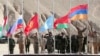 Національні прапори Таджикистану, Росії, Киргизстану, Казахстану, Білорусі та Вірменії (ліворуч-праворуч) під час спільних навчань ОДКБ, жовтень 2021 року