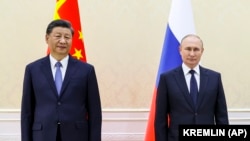Сі Цзіньпін (л) і Володимир Путін