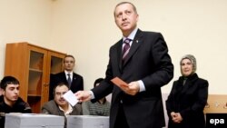 Prime Minister Recep Tayyip Erdogan casts his vote in Istanbul. The AK leader said his party had "learned [its] lesson."
