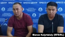 Qaster Musakhanuly (left) and Murager Alimuly appear at a press conferences in Almaty on October 14.