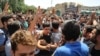 Iranian Police Fire Tear Gas After Protesters Swarm Tehran Bazaar
