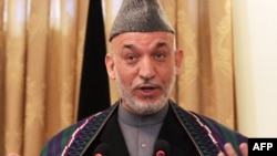 All eyes are on Afghan President Hamid Karzai as he unveils his new cabinet.