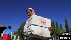آرشیف، بسته کمکی صلیب سرخ و هلال احمر به خانواده‌های نیازمند افغان