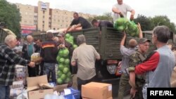 Ukrainian soldiers deliver food to residents of Slovyansk one day after liberating the city from pro-Russian separatists.