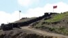 ARMENIA -- Azerbaijani (L) and Armenian checkpoints at the Sotk gold mine on the Armenian-Azerbaijani border, Gegharkunik province, June 18, 2021