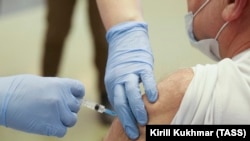 A man receives an injection of the Sputnik V vaccine against COVID-19 in Novosibirsk.
