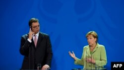 Aleksandar Vučić i Angela Merkel u Berlinu, juni 2014.