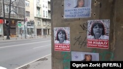 Posters by extreme nationalists denouncing Serbian human rights activist Natasa Kandic are posted on a building in Belgrade.