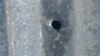 Armenia - A bullet hole on the roof of a house in the village of Khnatsakh, May 8, 2025.