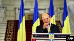 Romanian President Traian Basescu delivers a speech at the Cotroceni Palace in Bucharest on July 3.