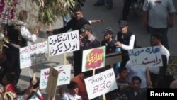 Protesters on April 21, the day that Syria lifted emergency rule, gather on a square in the southern city of Daraa.