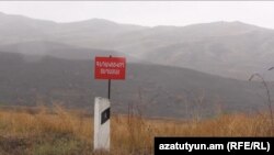 Armenia- A sign in Tavush province warning of cross-border gunfire from Azerbaijan. 