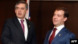 Brown (left) and Medvedev: cool in Japan on July 7