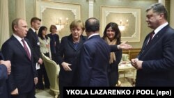 Зустріч у Мінську. Президент України Петро Порошенко, президент Франції Франсуа Олланд, канцлер Німеччини Анґела Меркель і президент Росії Володимир Путін. 11 лютого 2015 року