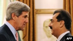 Pakistani Prime Minister Yousuf Raza Gilani (right) shakes hands with U.S. Senator John Kerry during a May 16 meeting in Islamabad