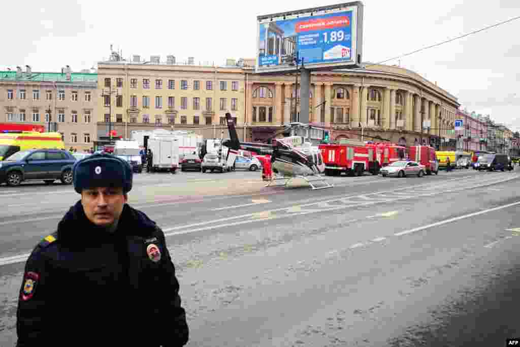 Emergency vehicles and a helicopter seen outside the entrance to St. Petersburg&#39;s Tekhnologichesky Institut subway station.&nbsp;