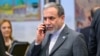 Iran Foreign Minister Abbas Araqchi talks on his mobile phone during the 51st session of the Council of Foreign Ministers of the Organization of Islamic Cooperation (OIC) in Istanbul on June 21, 2025.