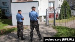 Belarusian police arrive at the office of the BelaPAN news agency in Minsk on August 7.