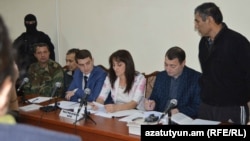 Nagorno Karabakh - Shahbaz Quliyev (R) and Dilgam Askerov (third from L), Azerbaijani men charged by Karabakh's authorities with sabotage, stand trial in Stepanakert,27Oct,2014