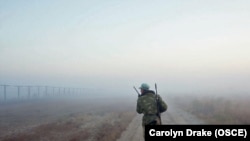 A trooper patrols along the Afghan-Tajik border.