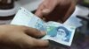 Ahmadinejad Blames West For Rial Plunge