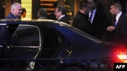 Former German Chancellor Gerhard Schroeder (center) speaks with Russian President Vladimir Putin (2nd left) at the entrance to the Yuspovsky Palace in St. Petersburg on April 28.