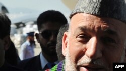 Afghan President Hamid Karzai upon his arrival at the Chaklala airbase in Rawalpindi today.