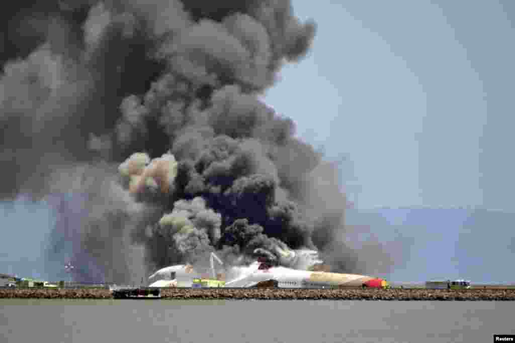 Asiana Airlines Flight 214 burns on the runway at San Francisco International Airport after crash-landing after a flight from Seoul. (Reuters/James O'Malley/Handout via Reuters)