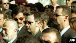 Шема -- (аьрро агlора аьтто агlор) Асад Джамил, инарла Шавкат Асеф, тlеман талламан урхаллин куьйгалхо Асад Махlер, президент Асад Башар а тlаьххьара президент Асад Хlафезан тезетахь, Димашкъ, 13Ман2012 