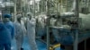 Iran Implements Nuclear Deal; EU Curbs Sanctions